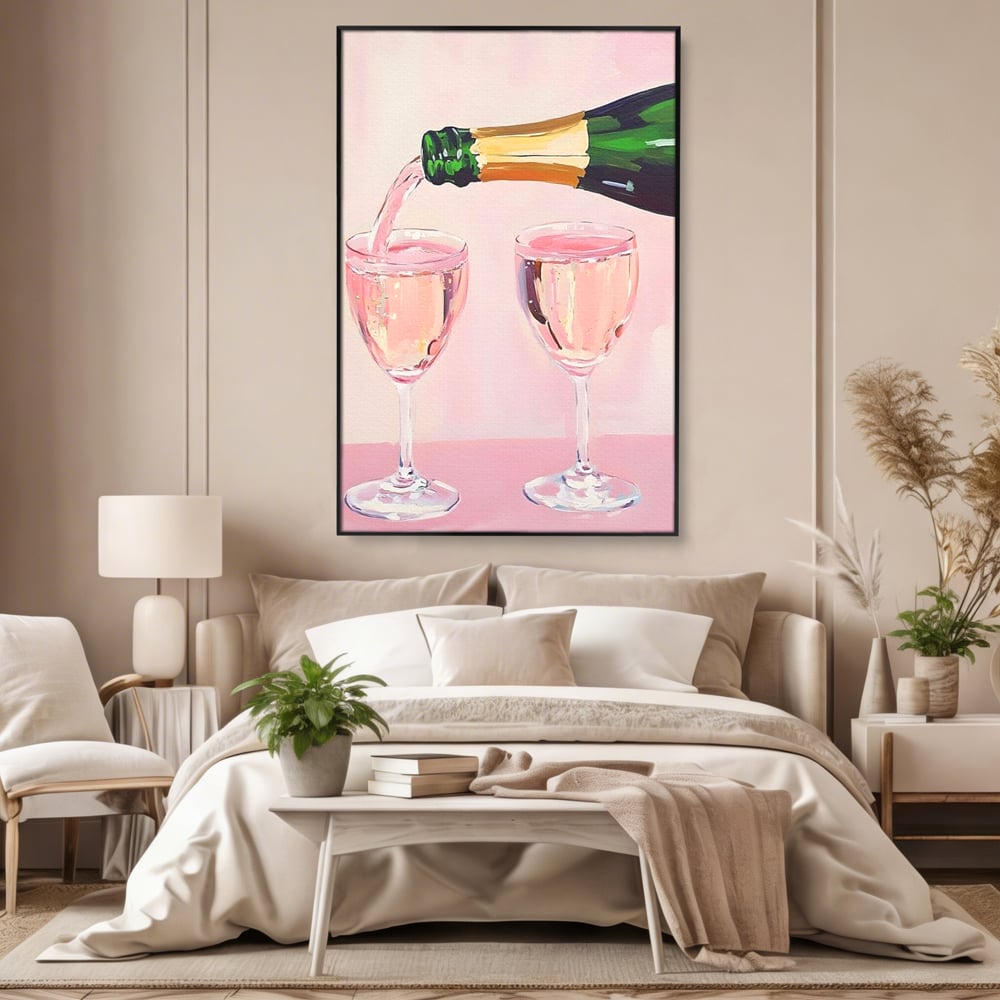 Tablou canvas cu pictura cu sticla si pahare de sampanie roz, in rama de aluminiu negru, pe perete intr-un dormitor